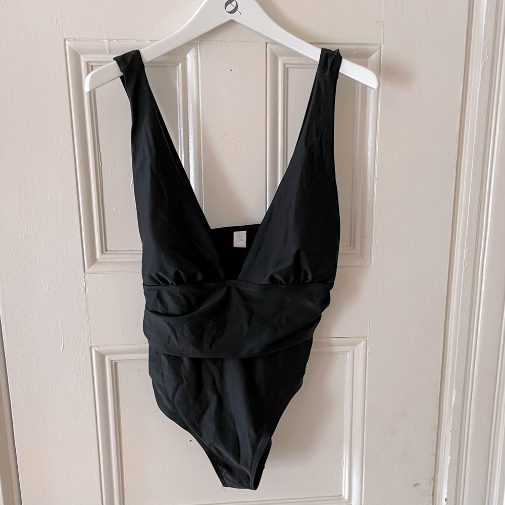 Low cut black one piece